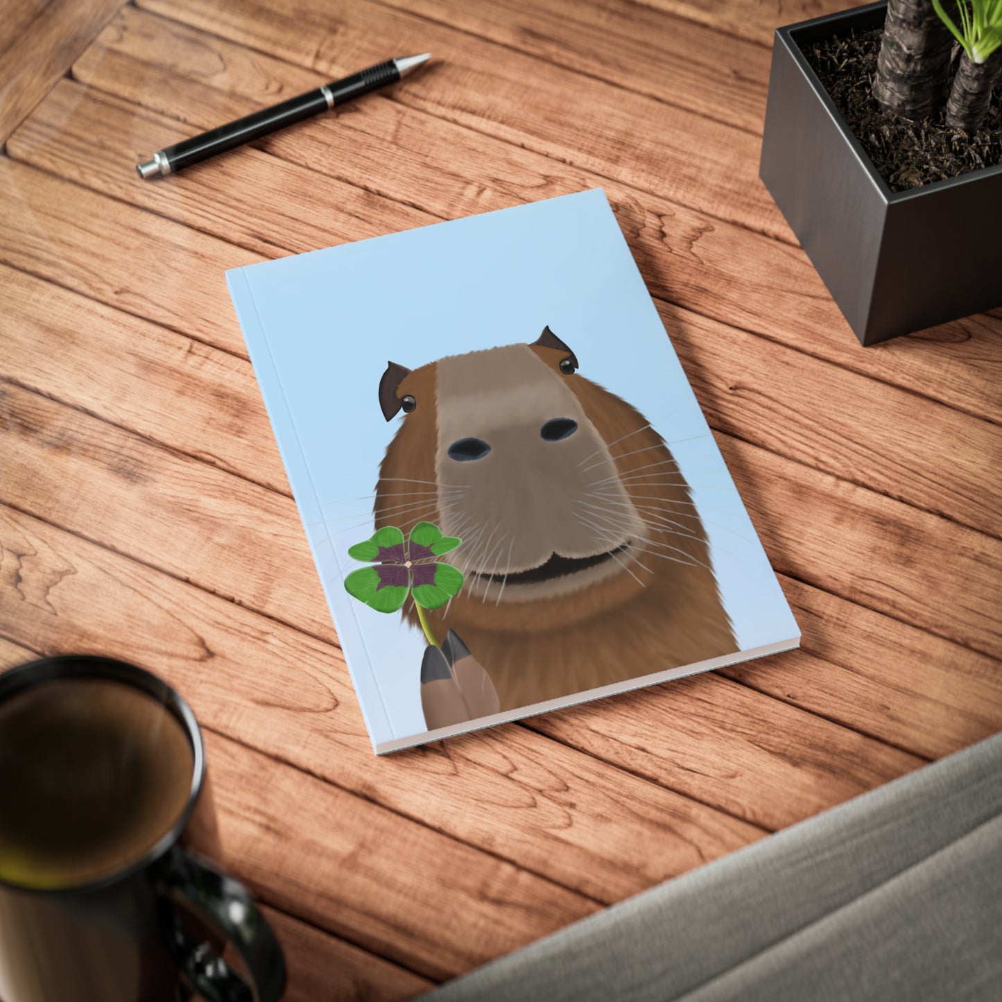 Capybara mit Glücksklee A5 Softcover Notizbuch 150 Seiten Liniert
