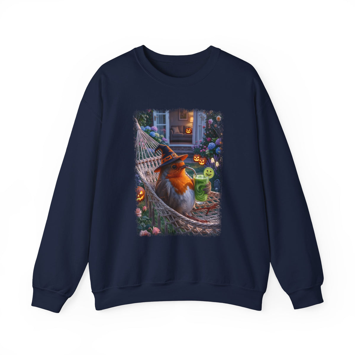 A navy blue crewneck sweatshirt featuring a large rectangular graphic print on the front. The graphic depicts a robin bird dressed as a witch sitting in a hammock surrounded by Halloween decorations, including jack-o'-lanterns and a green drink.