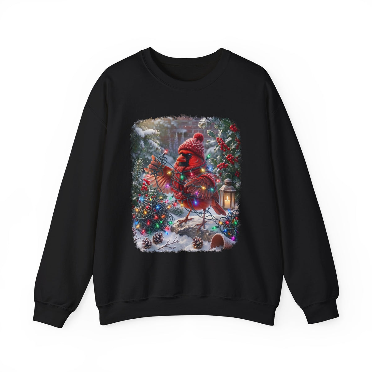 A black crewneck sweatshirt featuring a large, colorful graphic print of a Christmas cardinal wearing a red knit hat and scarf, standing in a snowy winter garden decorated with lights and ornaments.