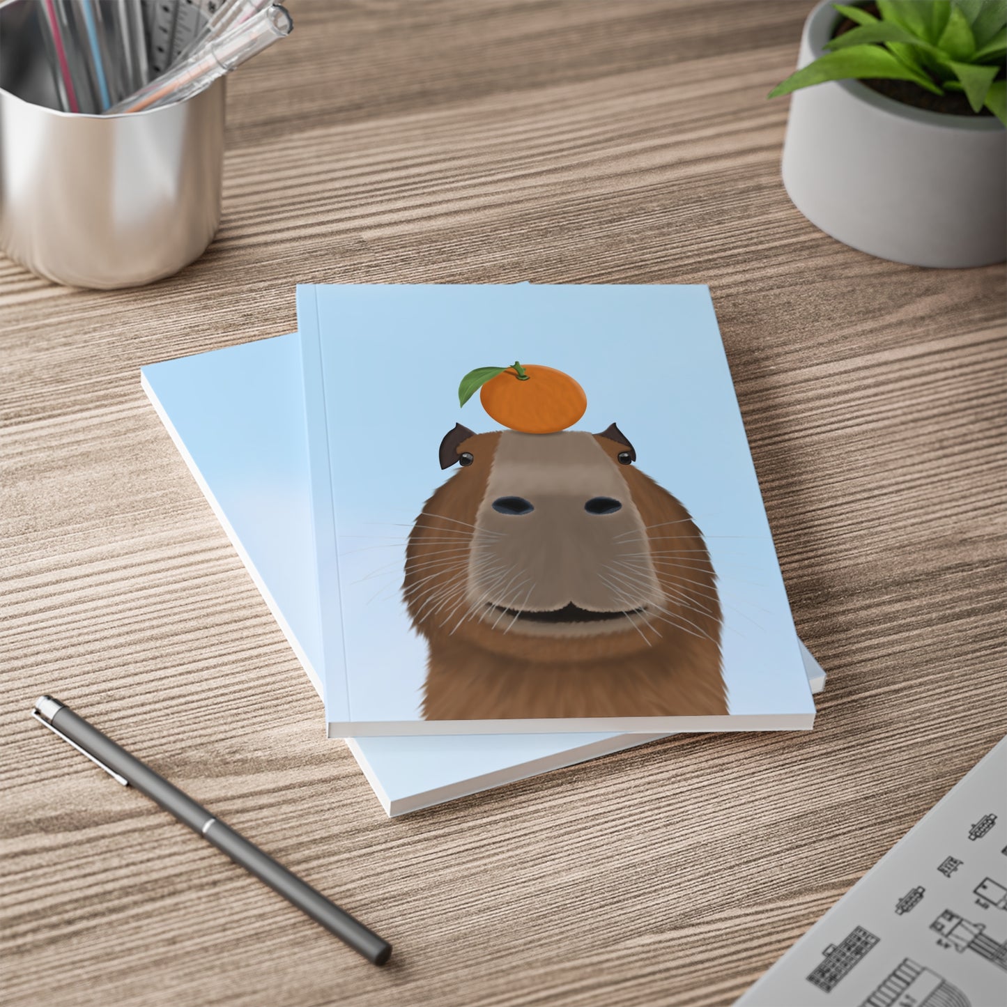 Capybara mit Orange A5 Softcover Notizbuch 150 Seiten Liniert