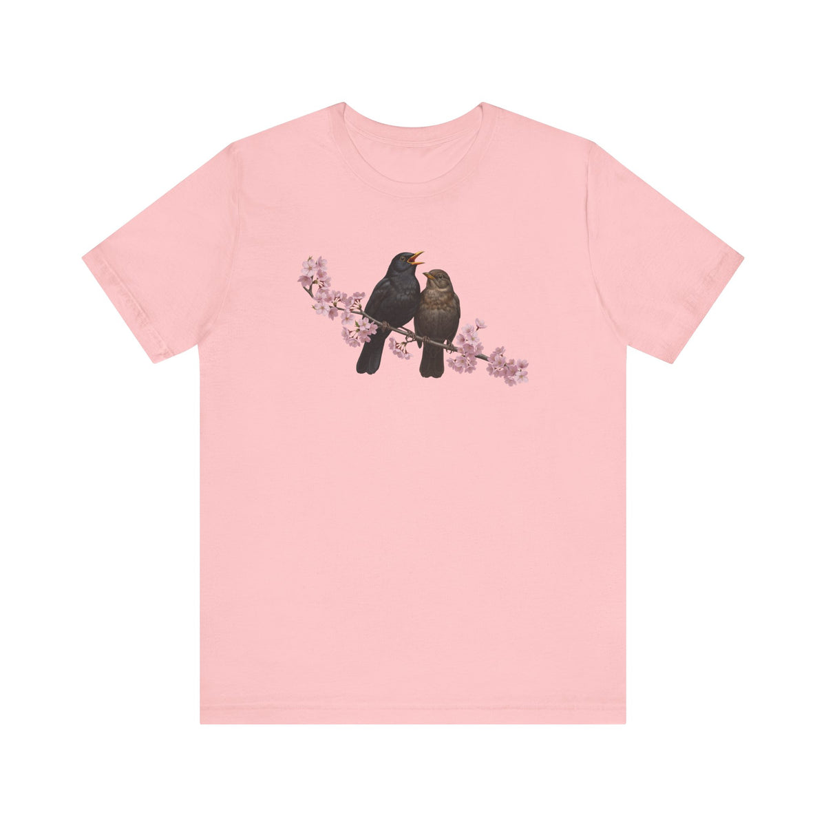 Pink t-shirt with two birds on a branch graphic on a white background