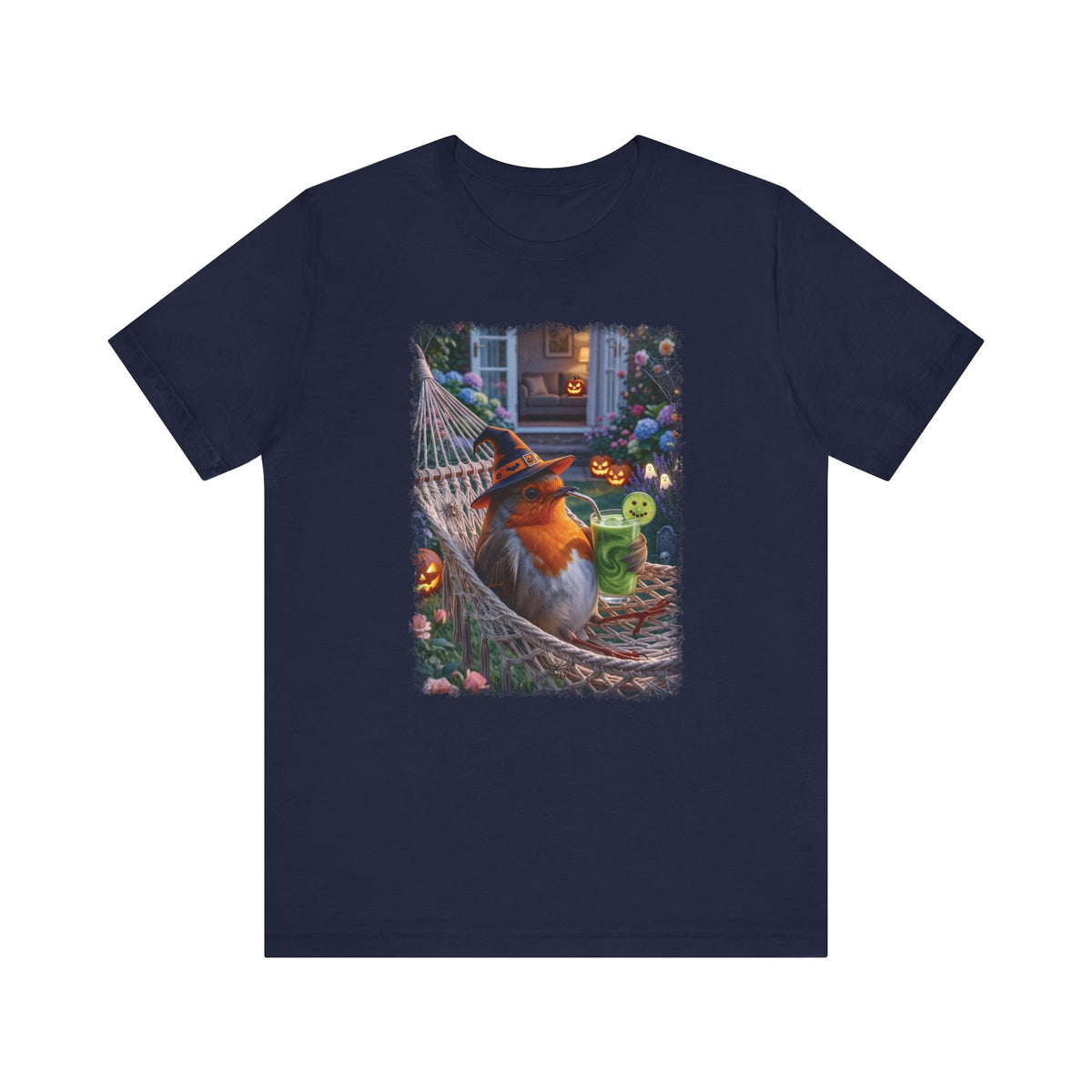 A navy blue short-sleeve crewneck t-shirt featuring a colorful graphic print of a robin bird wearing a witch hat and sitting in a hammock surrounded by Halloween decorations.