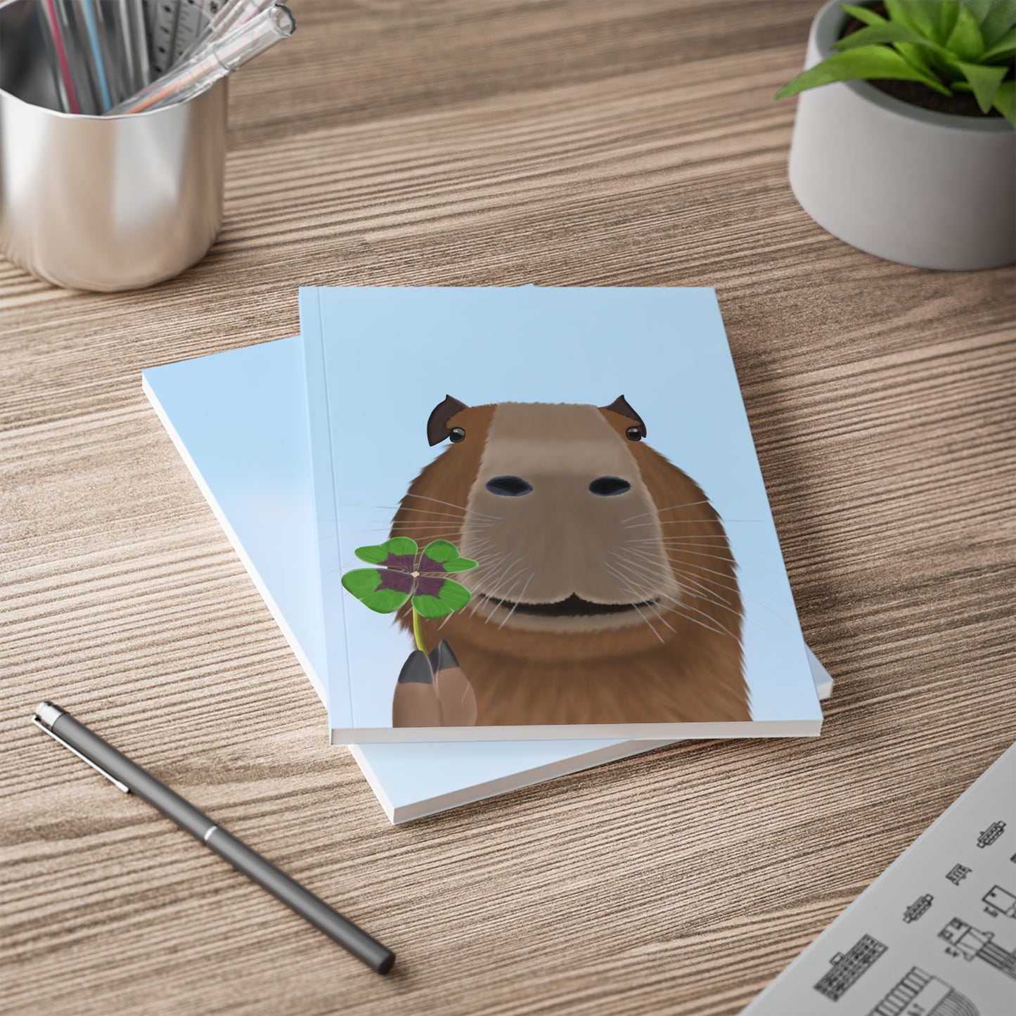 Capybara mit Glücksklee A5 Softcover Notizbuch 150 Seiten Liniert