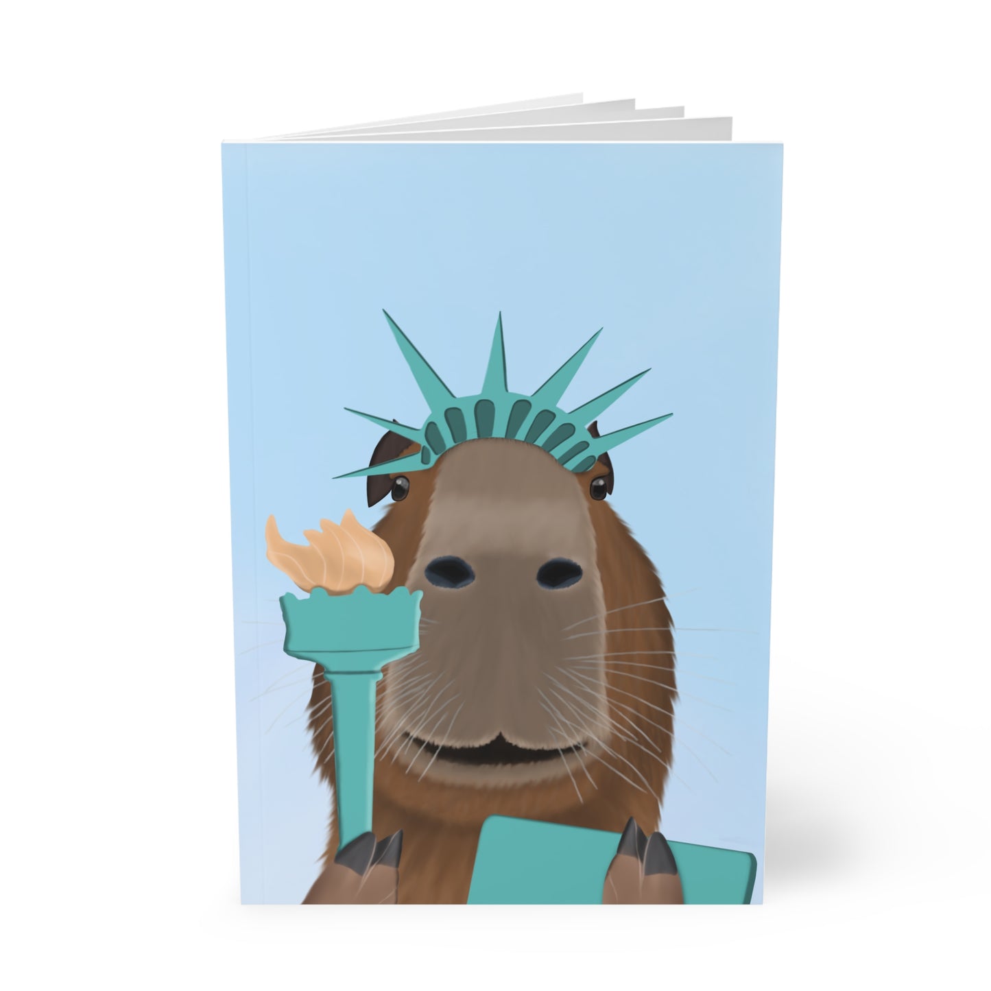 Capybara als Freiheitsstatue mit Krone, Fackel und Tafel A5 Softcover Notizbuch 150 Seiten Liniert