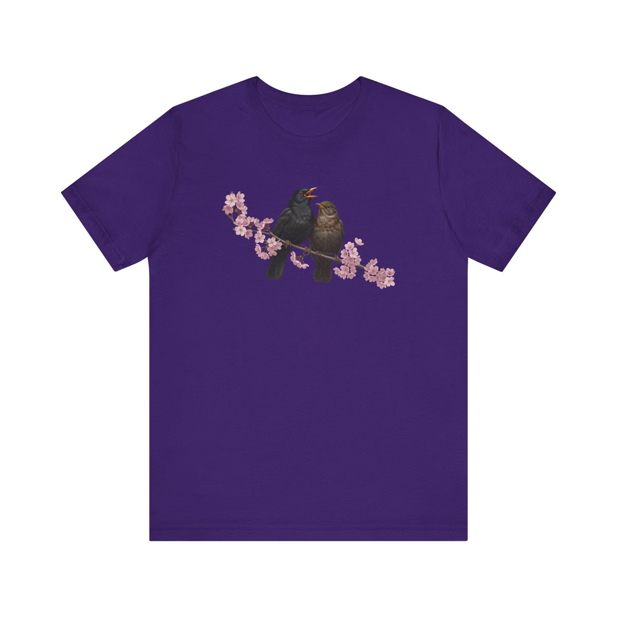 Purple t-shirt with a bird and cherry blossom design on a white background