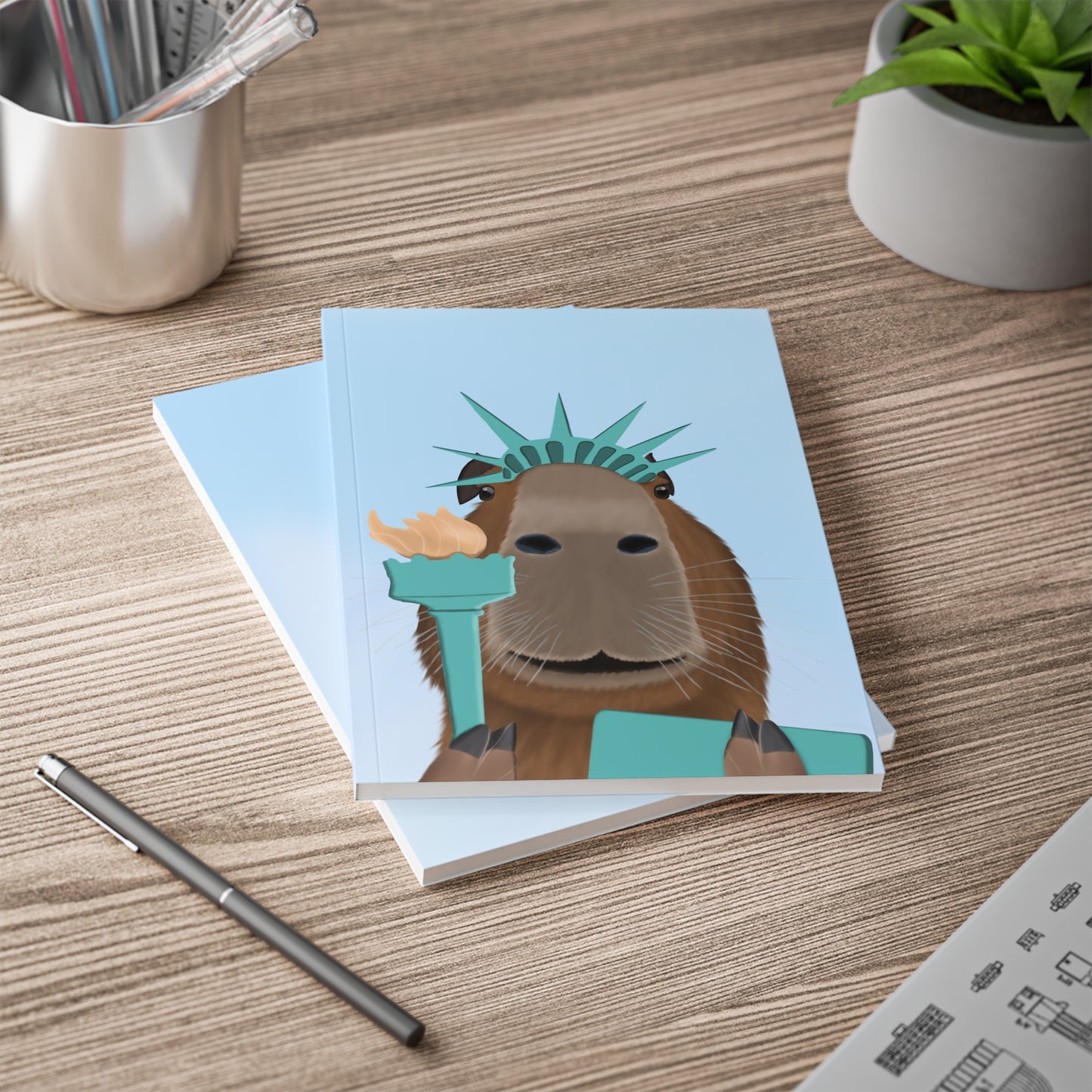 Capybara als Freiheitsstatue mit Krone, Fackel und Tafel A5 Softcover Notizbuch 150 Seiten Liniert
