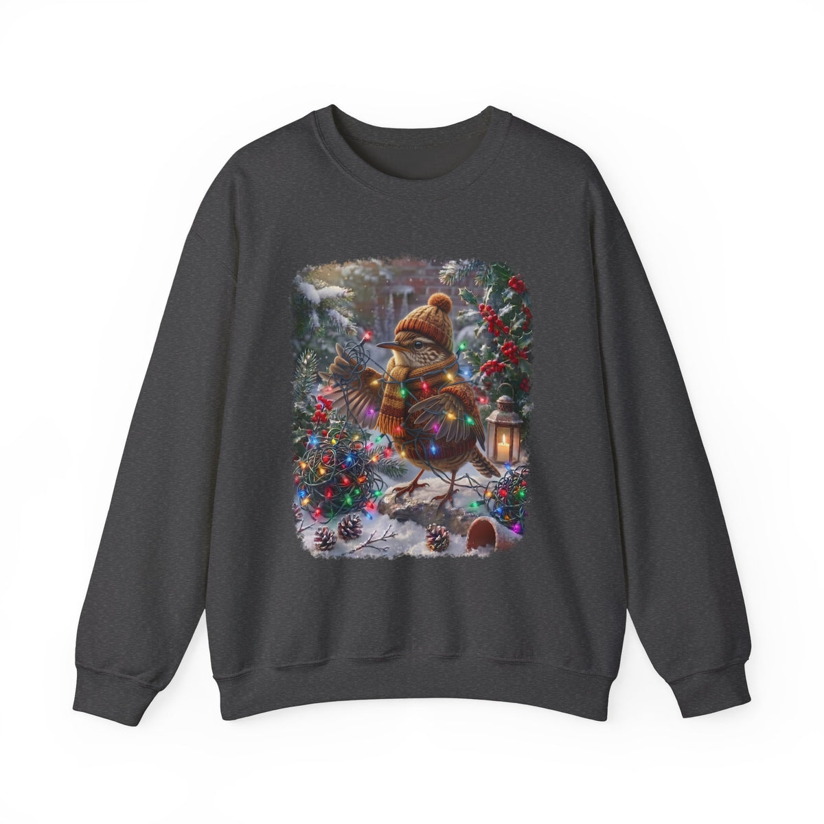 A dark gray crewneck sweatshirt featuring a large, colorful graphic print of a Christmas wren wearing a knit hat and scarf, standing in a snowy winter garden decorated with lights and pinecones.