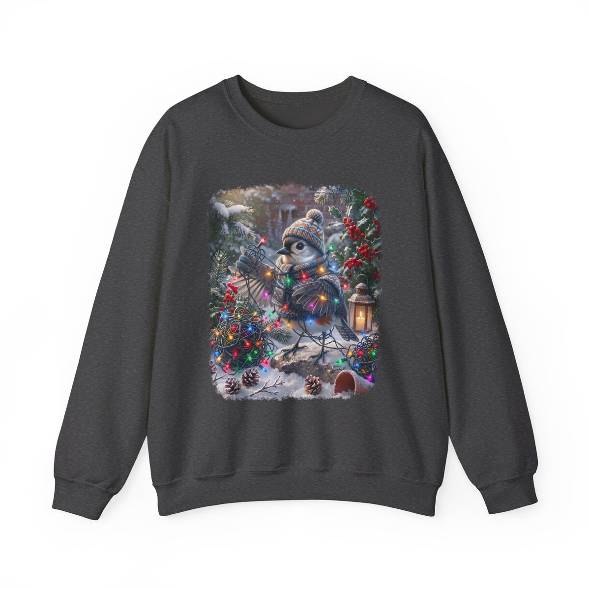 A dark gray crewneck sweatshirt featuring a colorful graphic print of a snowy winter scene with a tufted titmouse wearing a beanie and scarf, surrounded by Christmas lights, pinecones, and a lantern.