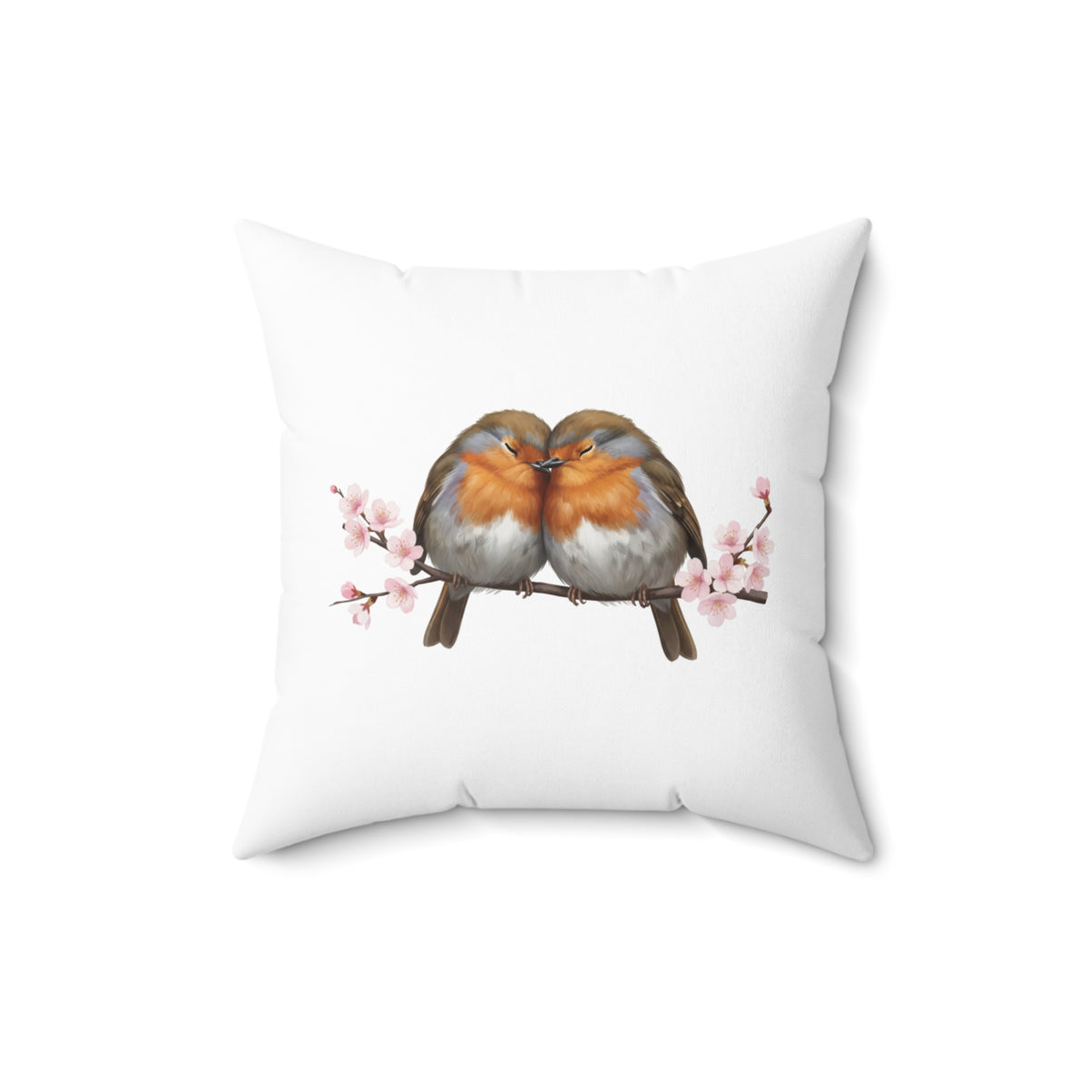 Decorative pillow with two birds on a branch and cherry blossoms on a white background
