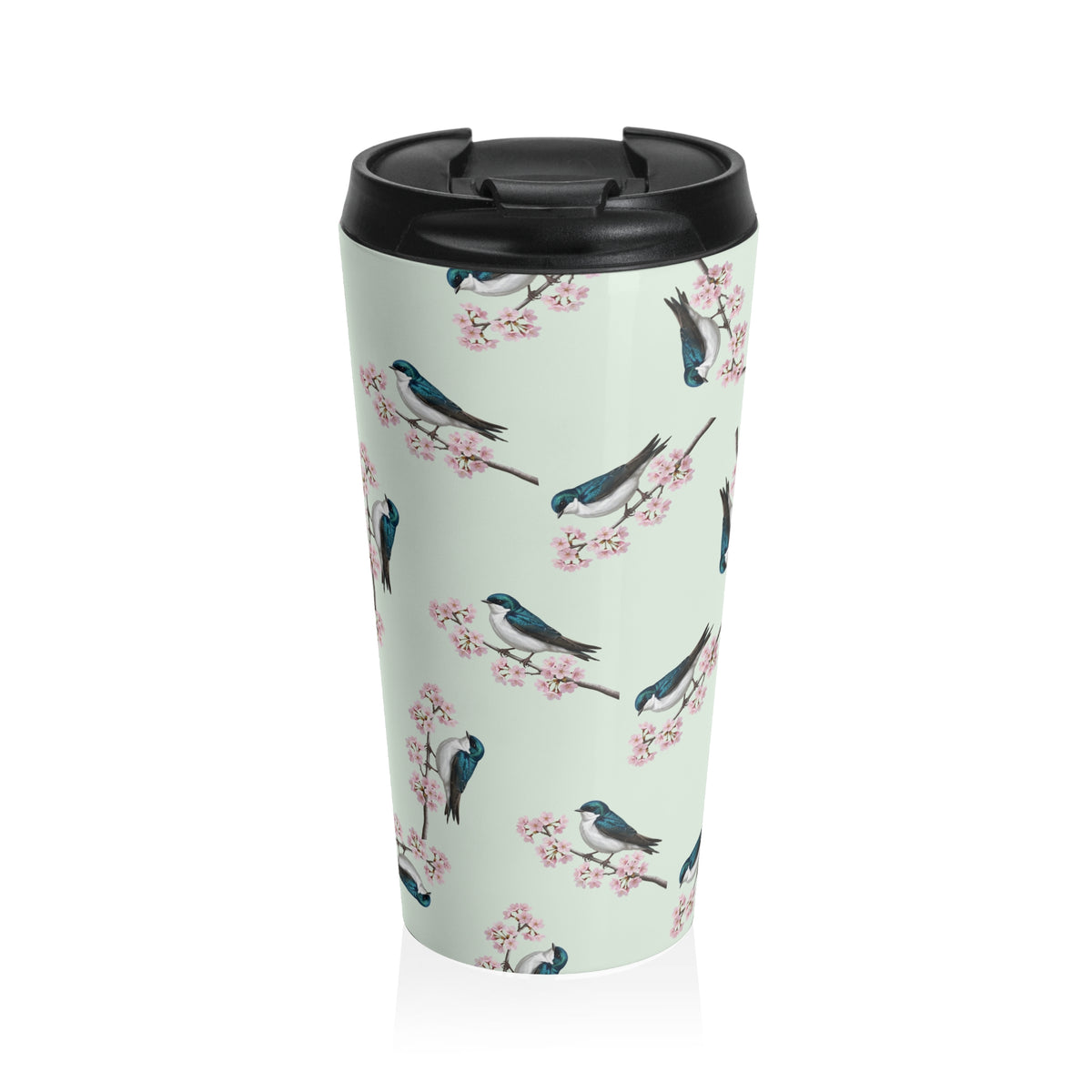 A premium 15oz stainless steel travel tumbler in sage green, featuring a seamless pattern of a Tree Swallow and cherry blossoms, with a black spill-proof lid. High-quality birdwatching coffee mug in e-commerce.