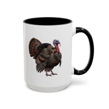 A white ceramic mug with a black interior and black handle, featuring a detailed graphic of a brown and black turkey with a red wattle on the side.