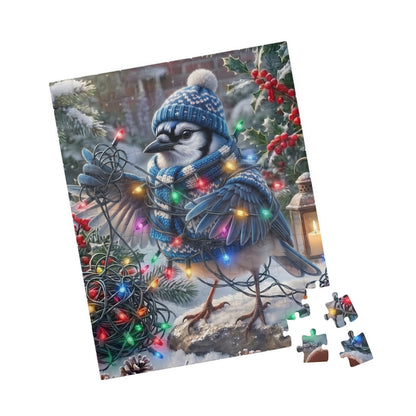 A completed jigsaw puzzle showing a winter blue jay bird illustration, displayed at an angle with several loose puzzle pieces beside it on a plain white background.