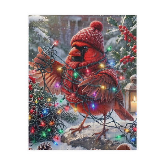 A square puzzle featuring a festive winter scene of a northern cardinal wearing a knit red hat and scarf, wrapped in multicolored Christmas lights, standing in snow with holly and berries.