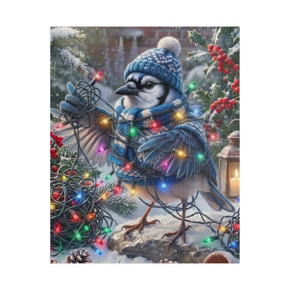 A festive winter illustration of a blue jay wearing a blue knit hat and matching scarf, surrounded by colorful Christmas string lights, snow, holly, and a lantern.