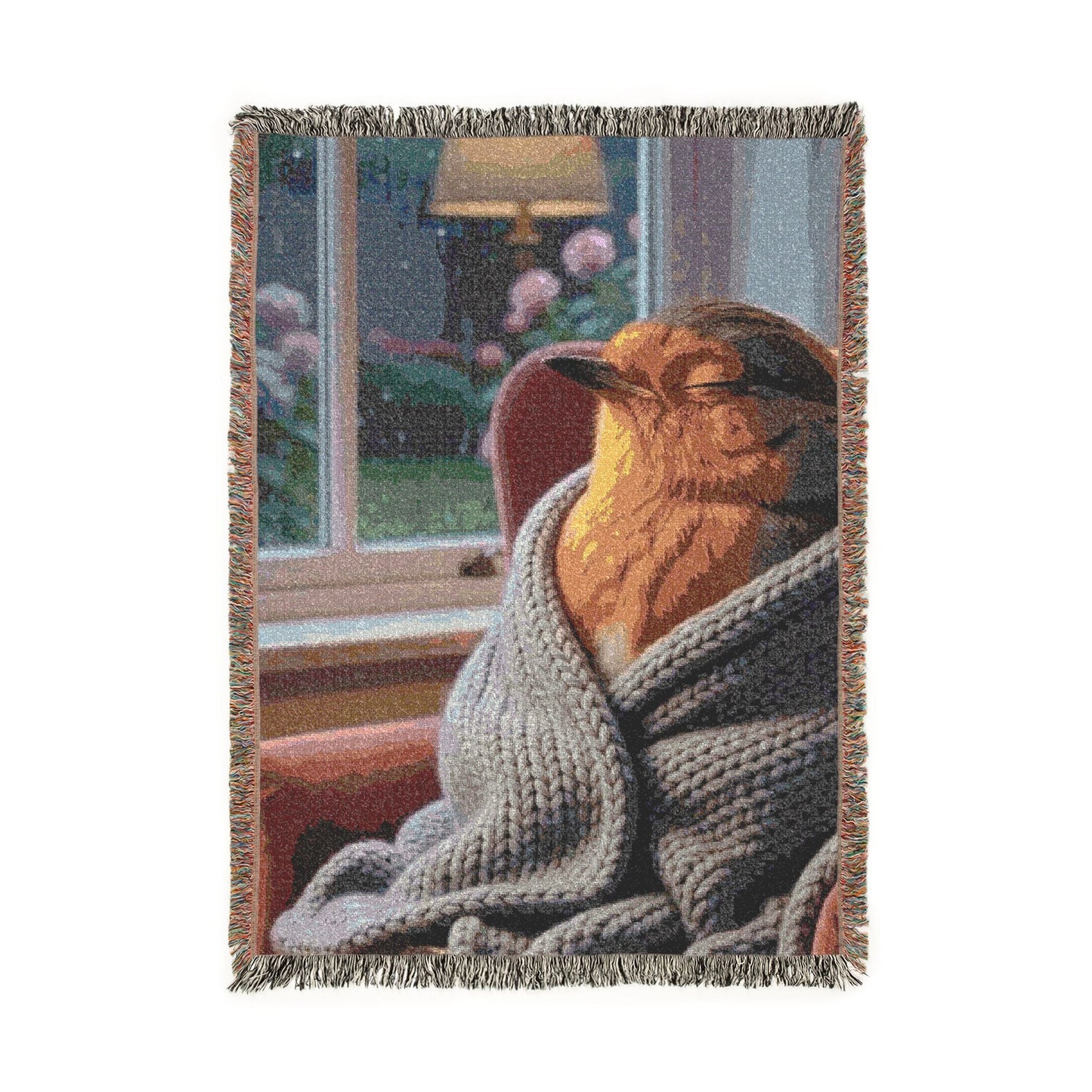 A rectangular woven throw blanket with fringed edges, featuring a printed scene of a robin bird wrapped in a gray knit sweater in front of a window. The blanket is shown upside down on a plain white background.