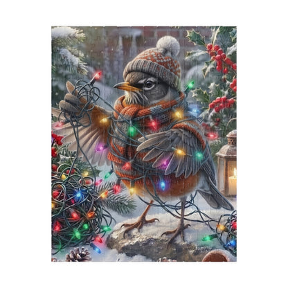A square jigsaw puzzle featuring a winter holiday scene with a robin wearing a knit hat and scarf, surrounded by snow, holly, red berries, and multicolored Christmas lights. The artwork is centered on a light gray background.