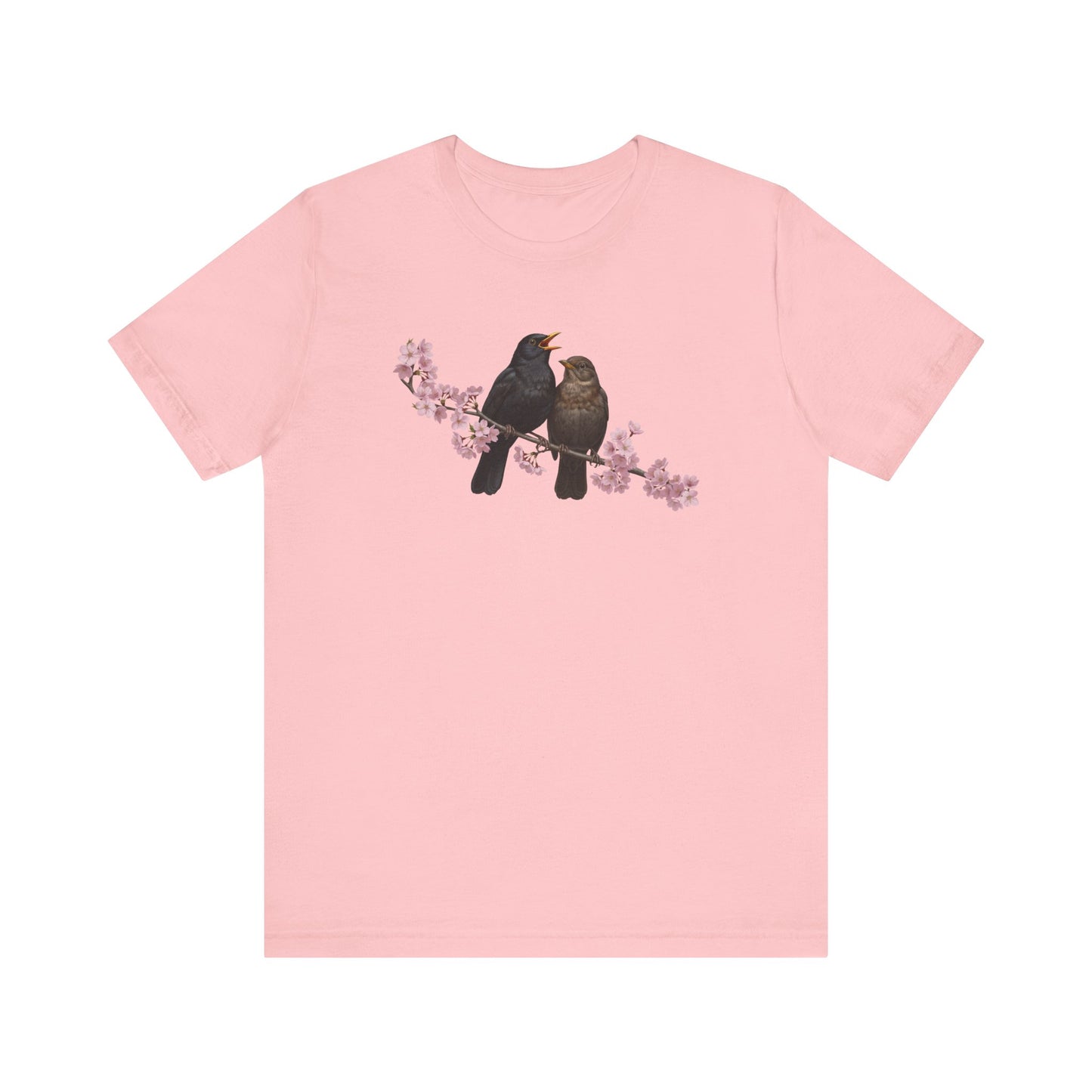Pink t-shirt with two birds on a branch graphic on a white background