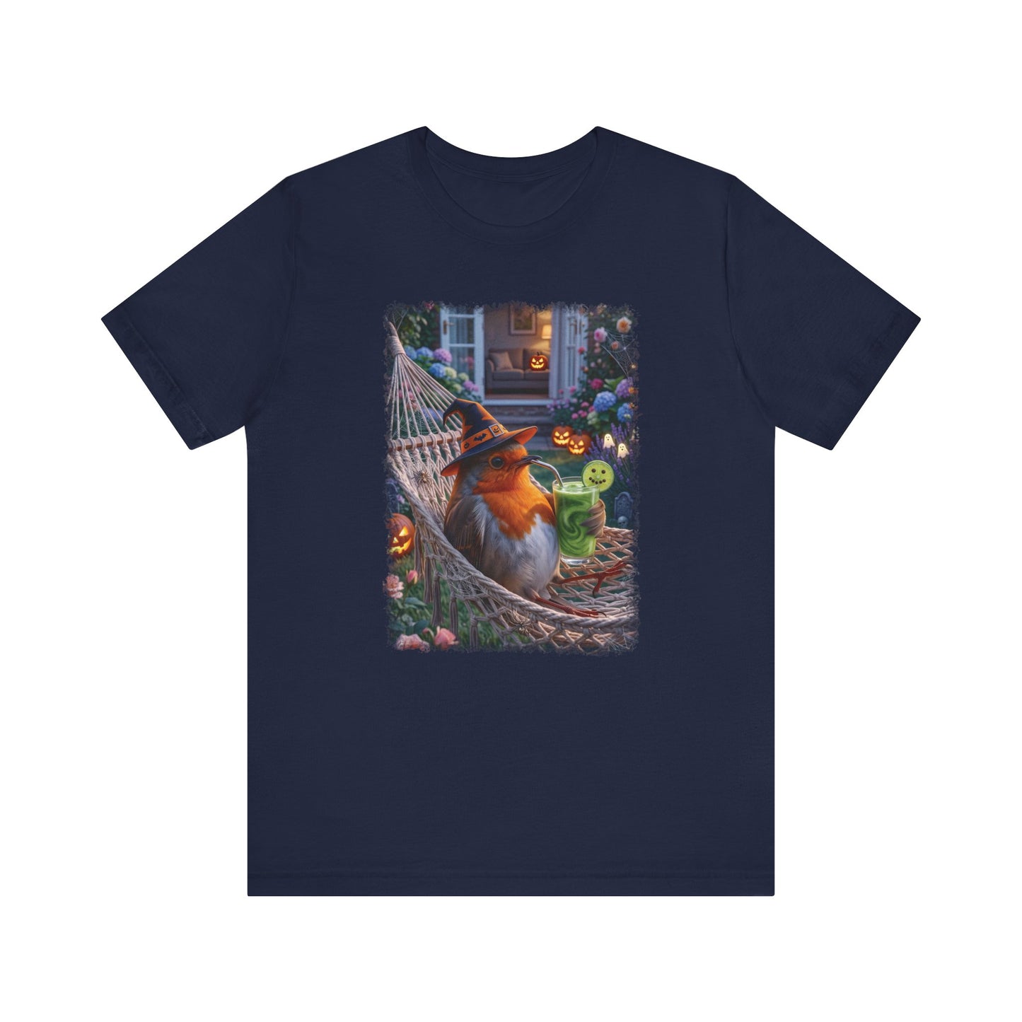 A navy blue short-sleeve crewneck t-shirt featuring a colorful graphic print of a robin bird wearing a witch hat and sitting in a hammock surrounded by Halloween decorations.