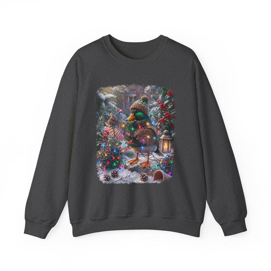 A dark gray crewneck sweatshirt featuring a large, colorful graphic print of a festive Christmas duck on a snowy tree, displayed against a plain white background.