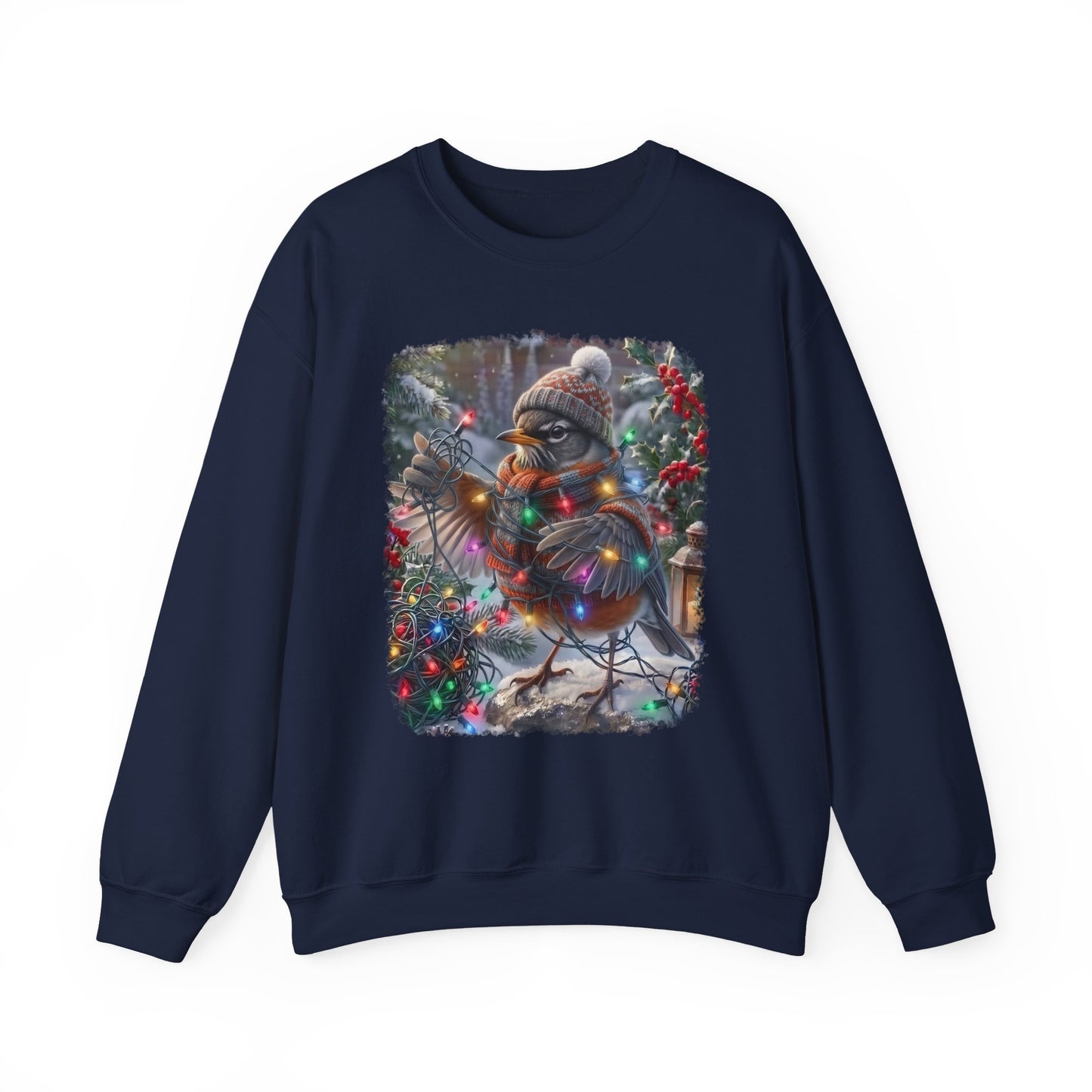A navy blue crewneck sweatshirt featuring a large square graphic print on the front of a winter robin bird wearing a knit hat and scarf, surrounded by colorful Christmas lights and festive decorations.