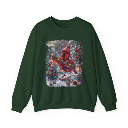 A dark green crewneck sweatshirt featuring a large, colorful graphic print on the front of a festive Christmas scene with a red cardinal, decorated trees, and snow.