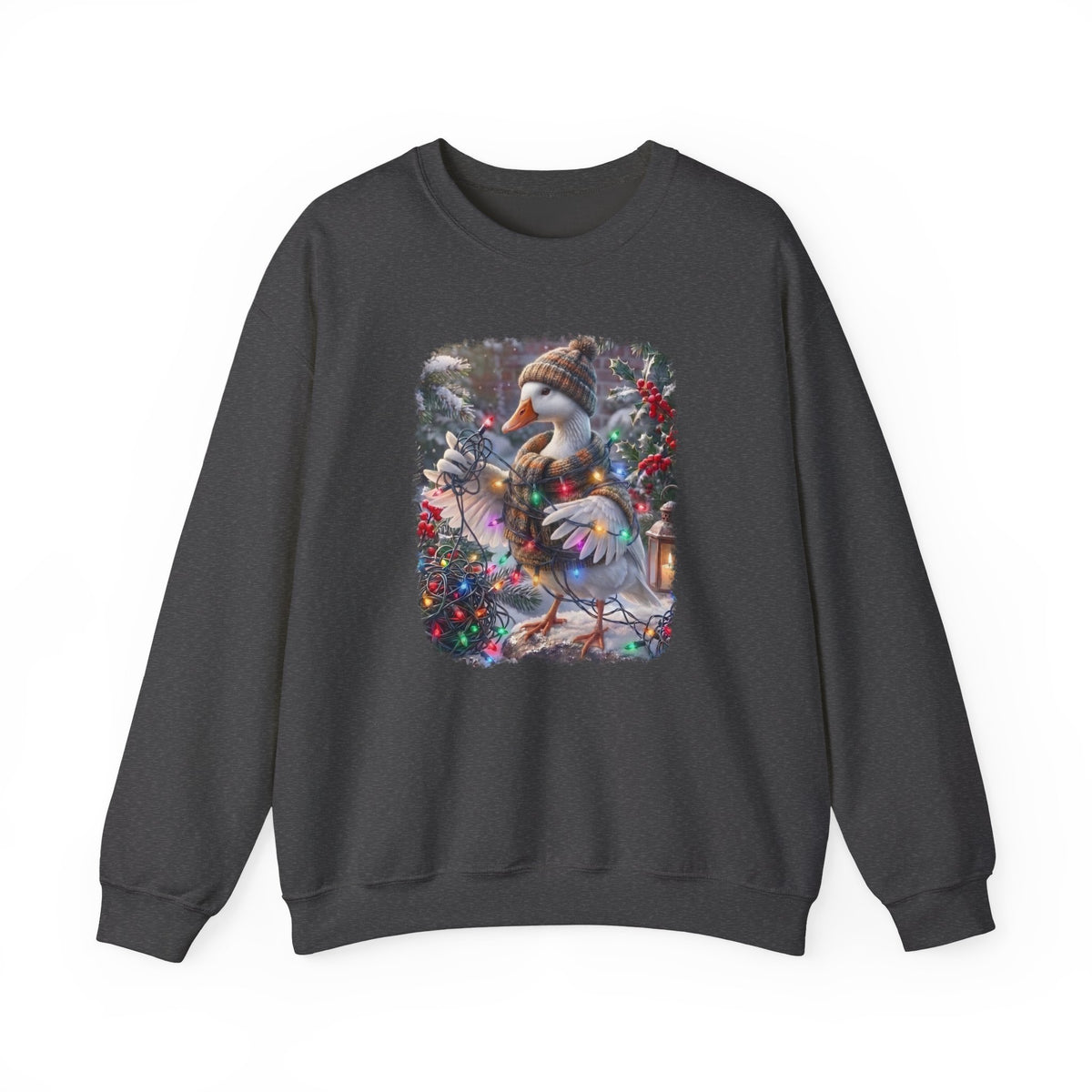 A dark gray crewneck sweatshirt featuring a colorful graphic print of a snowy goose wearing a knit hat and scarf, sitting on a decorated Christmas tree.