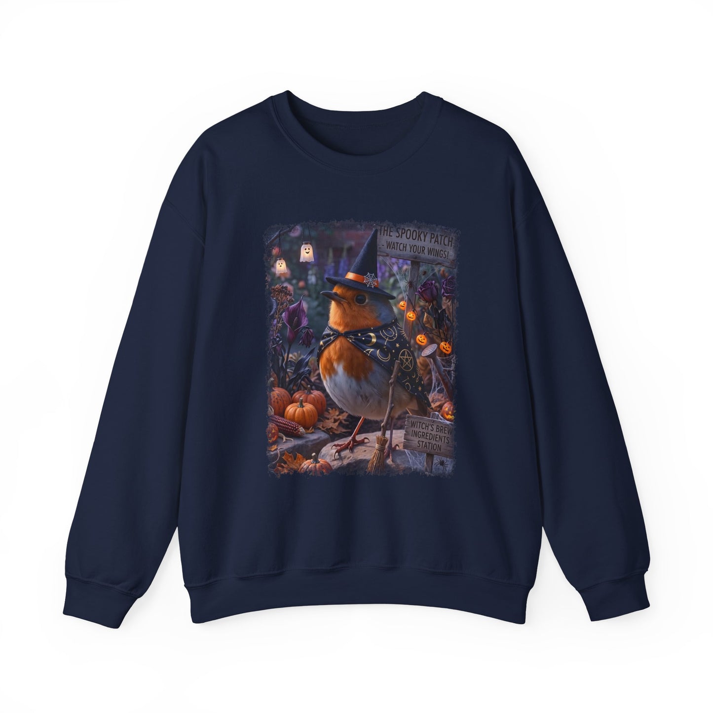 A navy blue crewneck sweatshirt featuring a large, colorful graphic print on the front of a robin bird dressed as a witch surrounded by pumpkins and autumn decorations.
