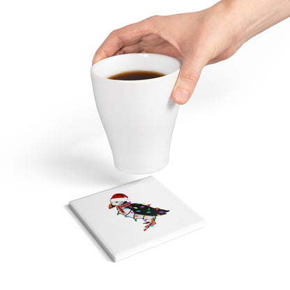 Keramik-Untersetzer Papageitaucher als Weihnachtsmann mit Lichterkette Weihnachtliches Vogel-Motiv