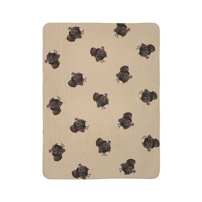 A rectangular beige blanket or mat with a repeating pattern of dark brown and black wild turkeys, shown flat against a solid white background.