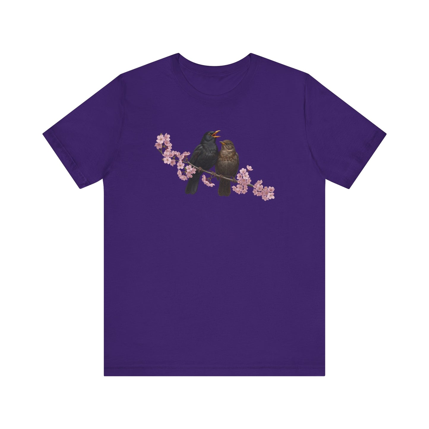 Purple t-shirt with a bird and cherry blossom design on a white background
