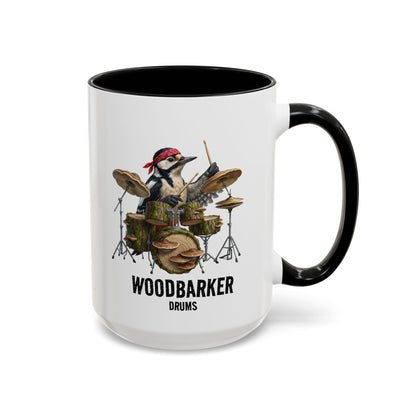 Mug with a woodpecker playing drums design and 'Woodbarker Drums' text on a white background.