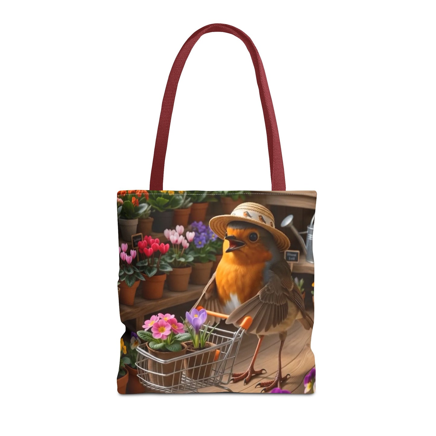 A tote bag with a printed illustration of a robin bird wearing a hat and pushing a flower cart, set against a background of potted flowers. The bag has dark red handles and is shown on a plain white background.