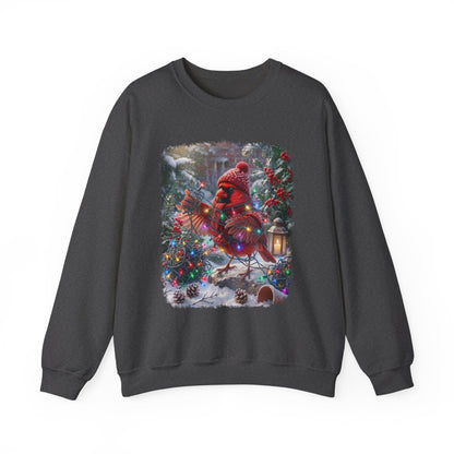 A dark gray crewneck sweatshirt featuring a large, colorful graphic print of a red cardinal dressed in a festive red knit hat and scarf, standing in a snowy Christmas tree scene with a lantern.
