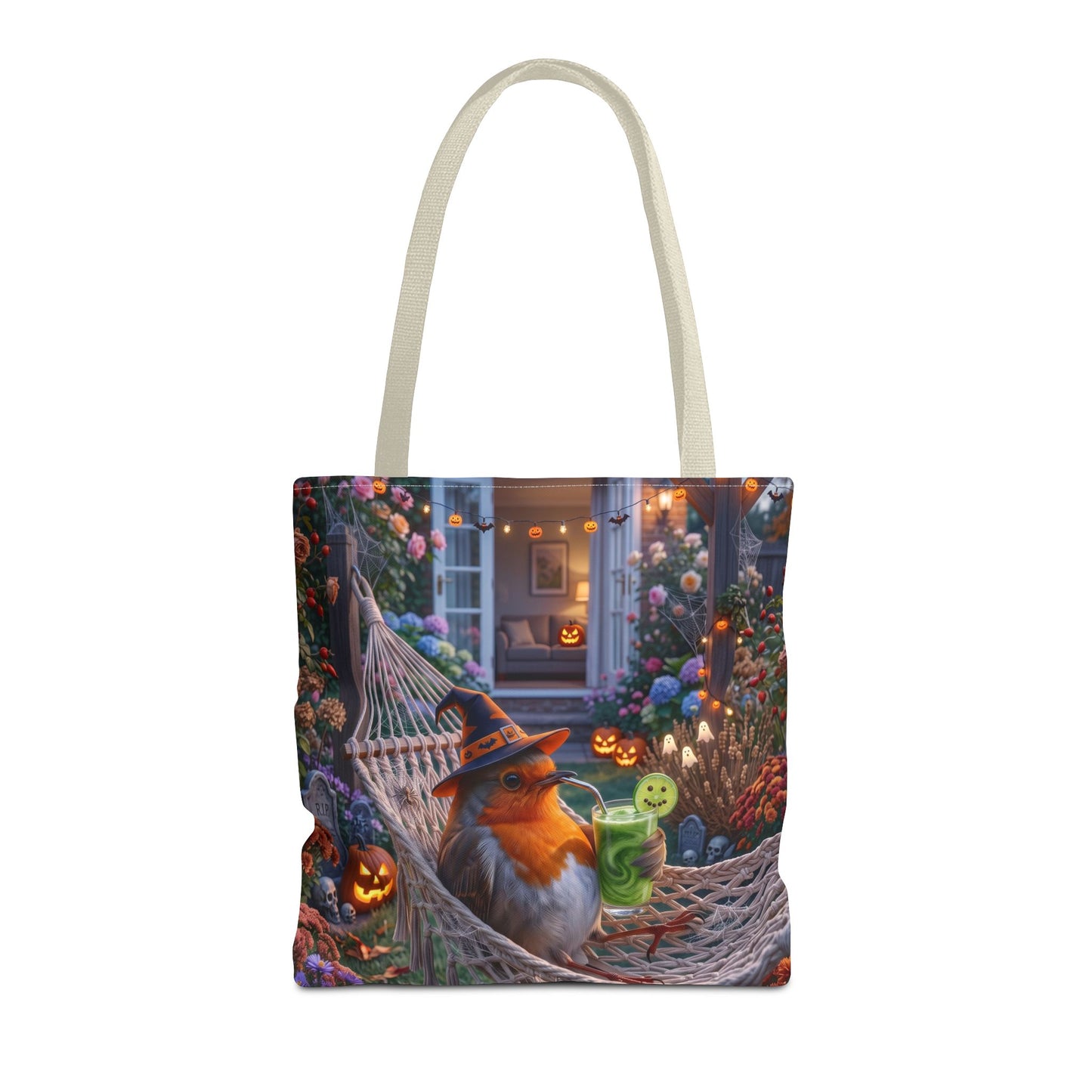 A cream canvas tote bag featuring a detailed Halloween-themed illustration of a robin birdlounging in a hammock surrounded by jack-o'-lanterns and flowers, shown against a plain white background.