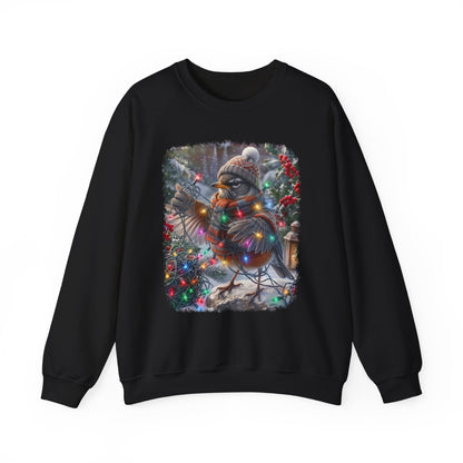 A black crewneck sweatshirt featuring a square graphic print of a robin bird wearing a knit hat and scarf, surrounded by colorful Christmas lights and festive decorations.
