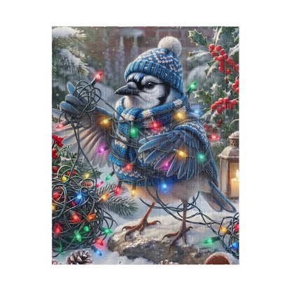 A festive winter scene featuring a blue jay wearing a blue knit hat and matching scarf, surrounded by colorful Christmas lights, snow, pine branches, holly with red berries, and a lantern.