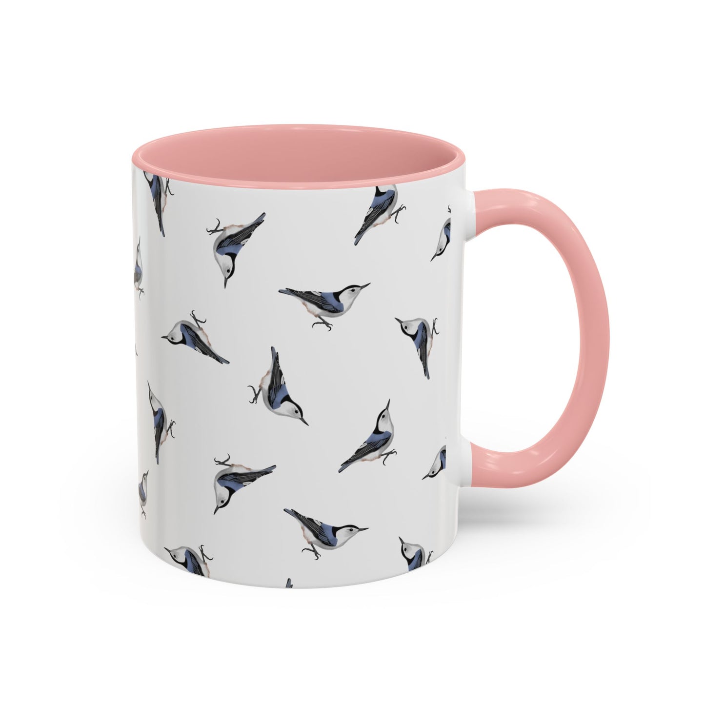 Mug with bird pattern and pink handle and interior on a white background