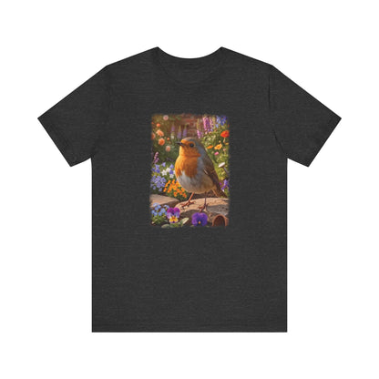 A dark heather gray short-sleeve t-shirt with a colorful graphic print of a robin bird perched among purple, yellow, and blue flowers on a wooden fence.