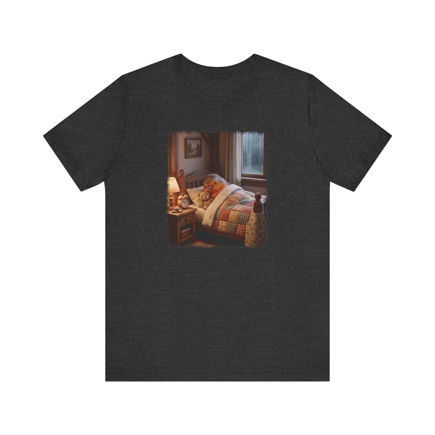 A dark heather gray short-sleeve t-shirt with a rectangular graphic print on the chest depicting a cozy bedroom scene with a robin bird, a teddy bear, bed, lamp, and window.