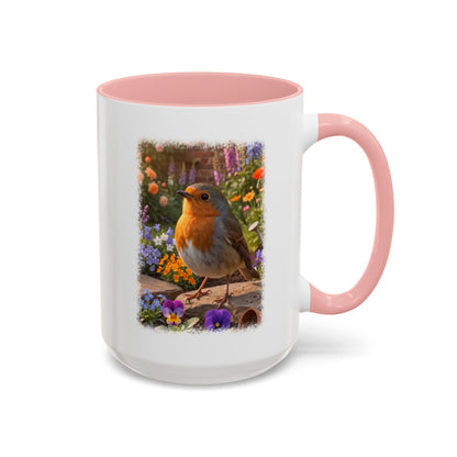 A white ceramic mug with a pink interior and handle, featuring a printed graphic of a robin bird perched among colorful flowers.