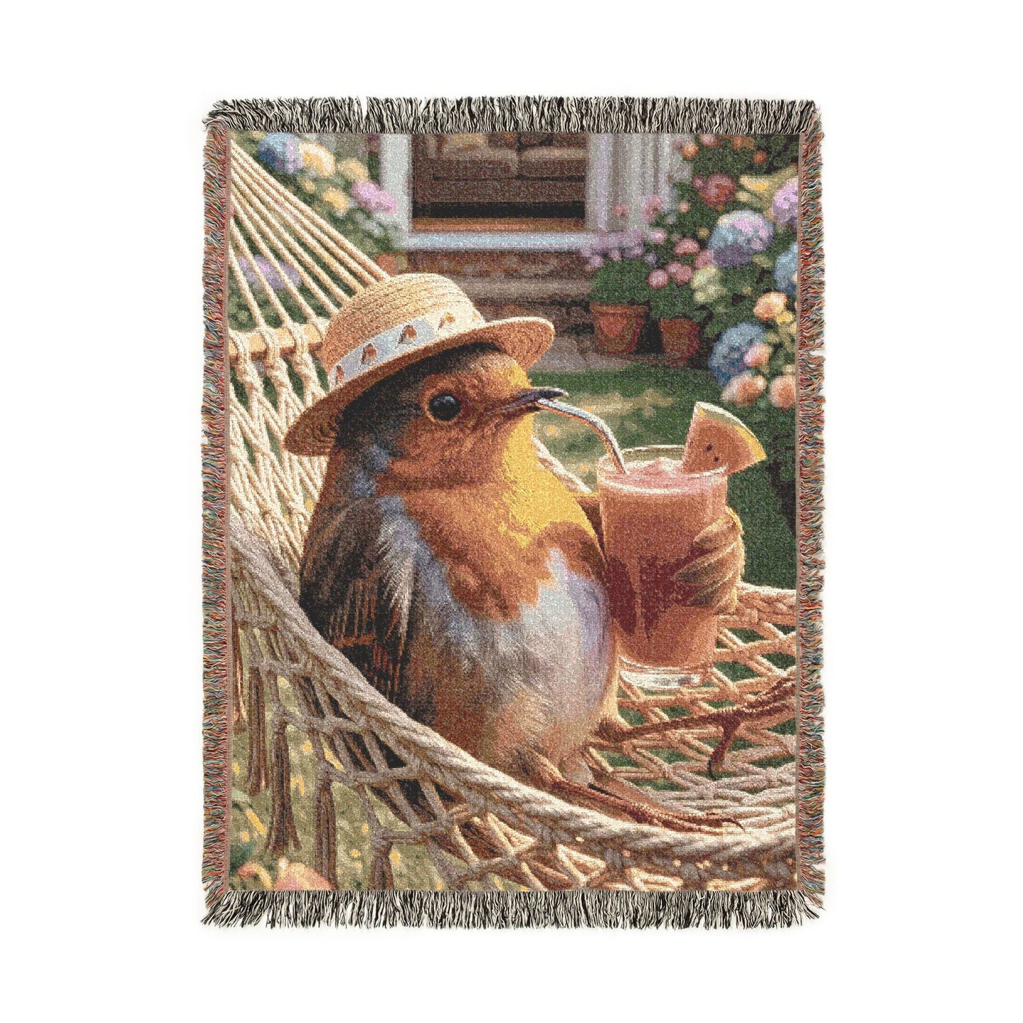 A woven throw blanket featuring a whimsical illustration of a robin bird wearing a straw hat and holding a smoothie inside a hammock, with fringed edges.