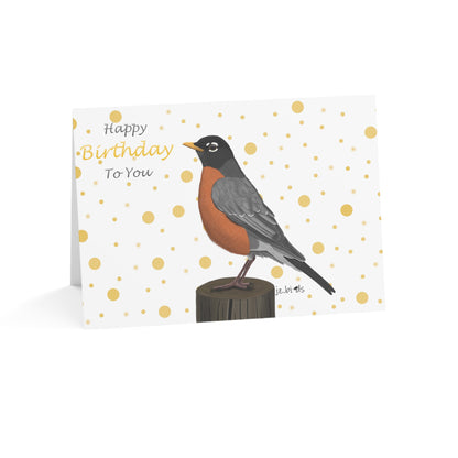 Birthday card with a robin illustration on a white background with gold polka dots.