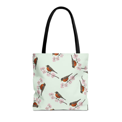 Tote bag with an american robin bird and cherry blossom pattern on a light green background