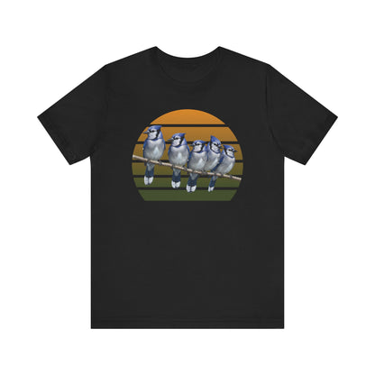 Black t-shirt with a graphic of five blue Jays on a branch against a sunset background.