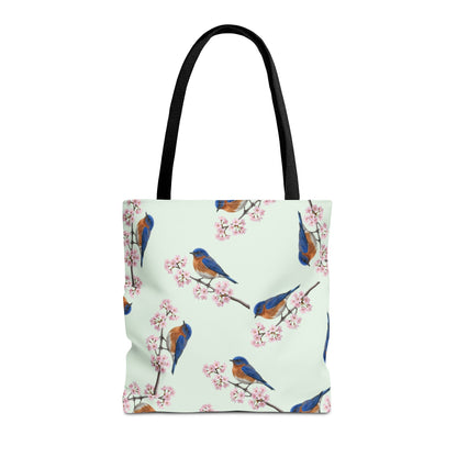 Tote bag with bluebird and cherry blossom pattern on a white background