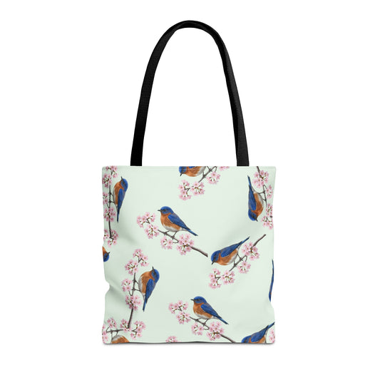Tote bag with bluebird and cherry blossom pattern on a white background