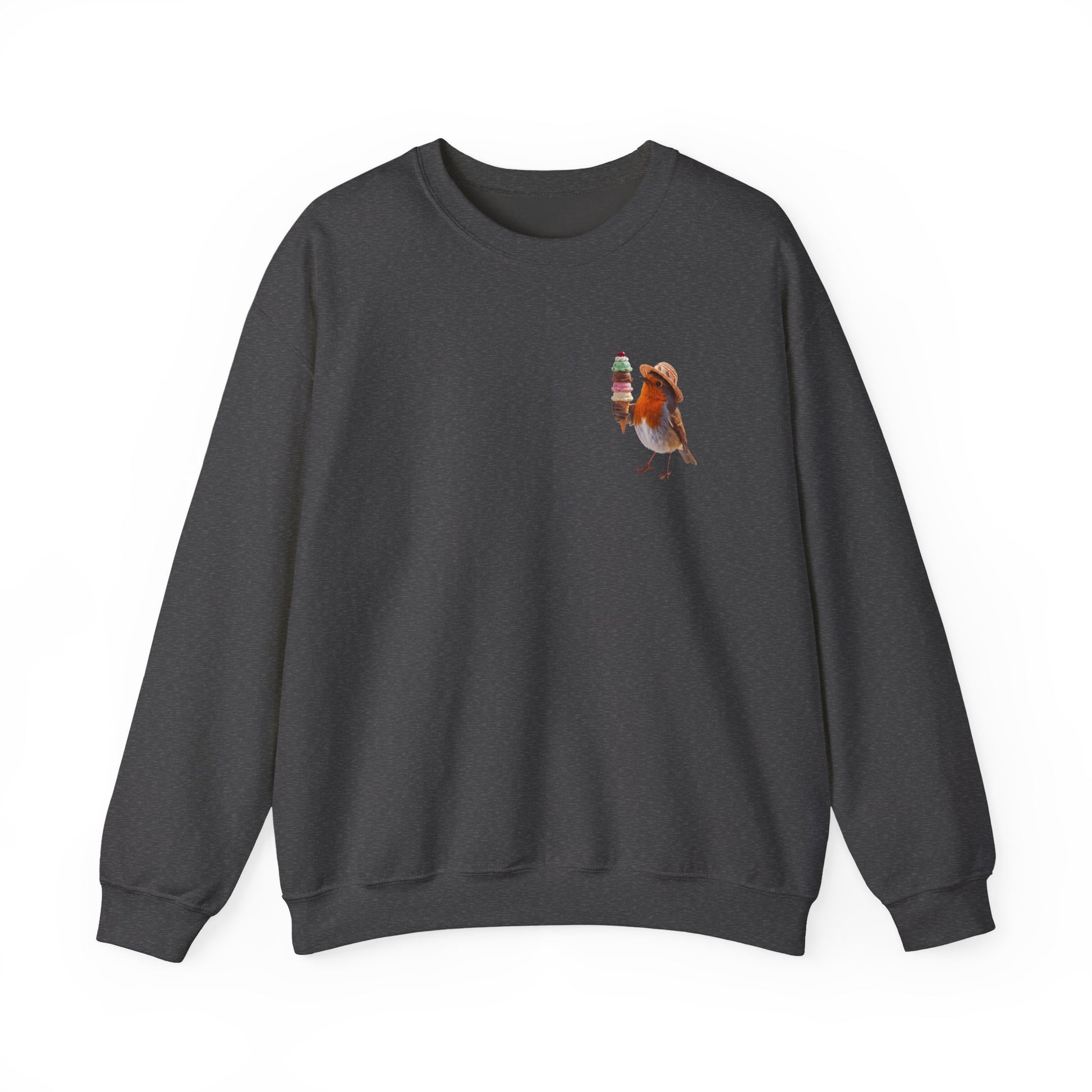 Close-up of the subtle pocket-sized design on the cozy sweatshirt, highlighting the bright colors of the cute Robin Rosi bird and ice cream illustration against the soft fabric.