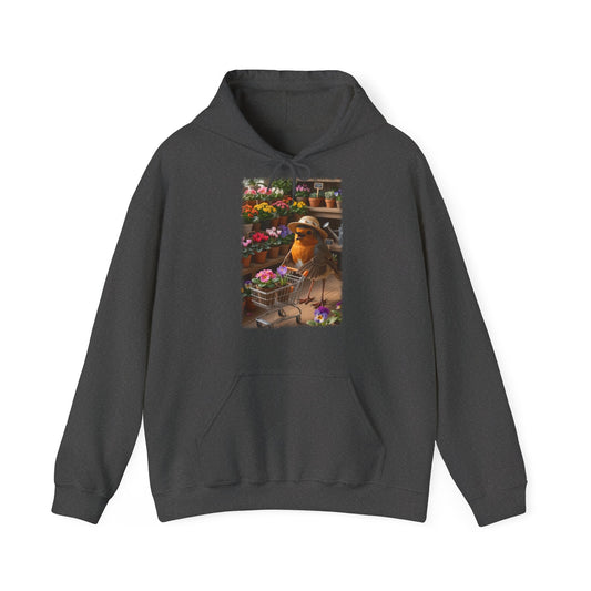Digital gemalte Illustration eines glücklichen Rotkehlchens mit Sonnenhut, das an einer Blume schnuppert und einen vollen Einkaufswagen schiebt, gedruckt mit weichen Acryl-Kanten auf einem gemütlichen Unisex-Hoodie.