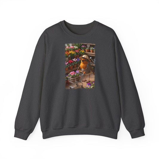 Digital gemalte Illustration eines glücklichen Rotkehlchens mit Sonnenhut, das an einer Blume schnuppert und einen vollen Einkaufswagen schiebt, gedruckt mit weichen Acryl-Kanten auf einem warmen Unisex-Sweatshirt.
