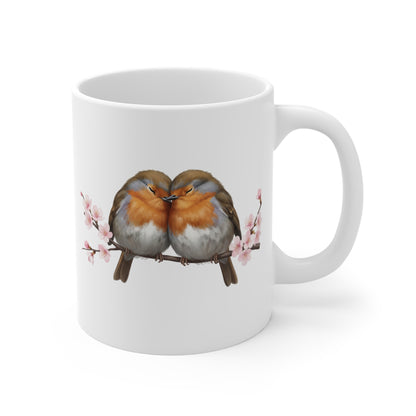 White mug with two birds on a branch design on a white background